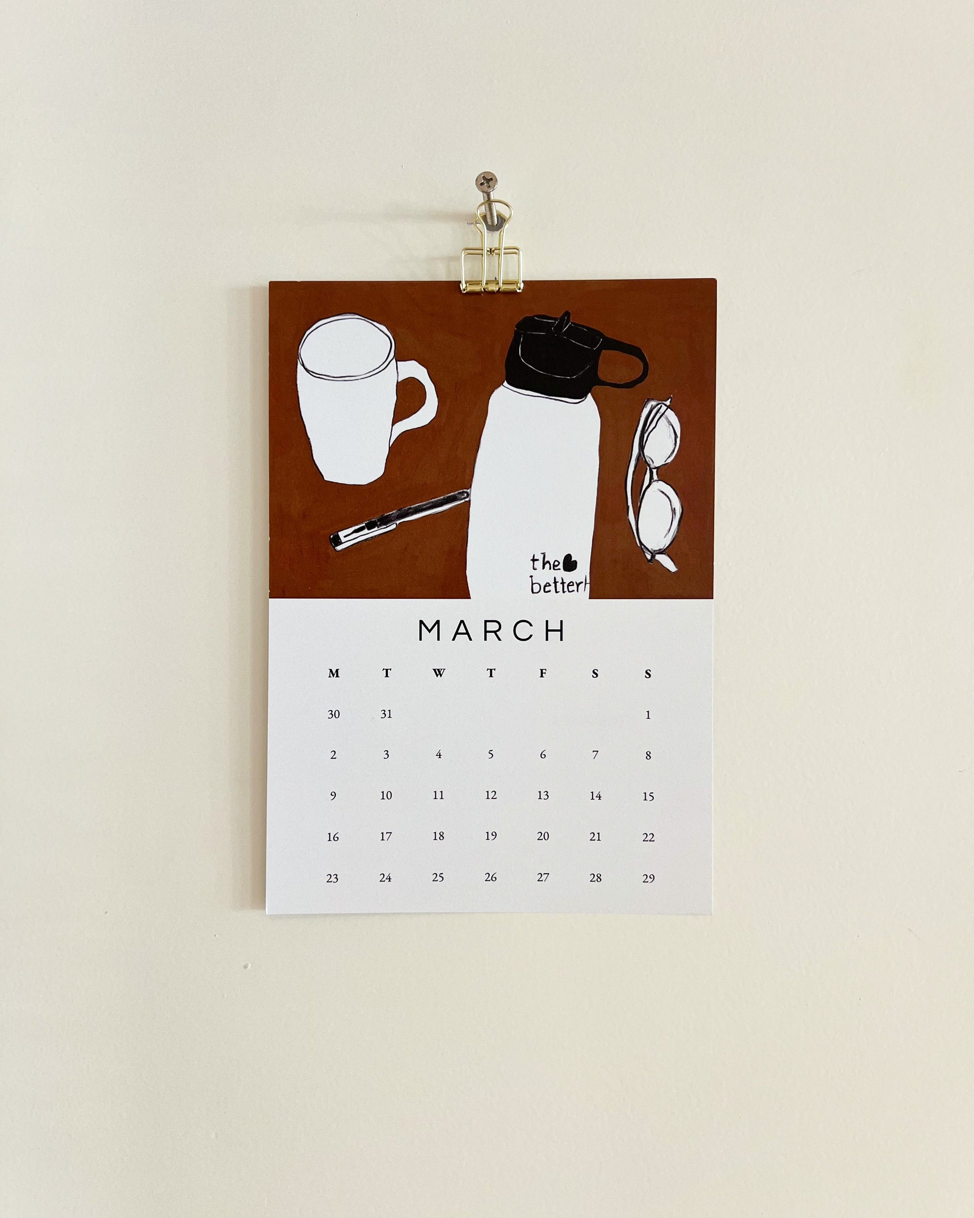 2026 Wall/Desk Calendar with March sketchbook original art/illustration of a coffee cup, water bottle, and glasses on a brown background