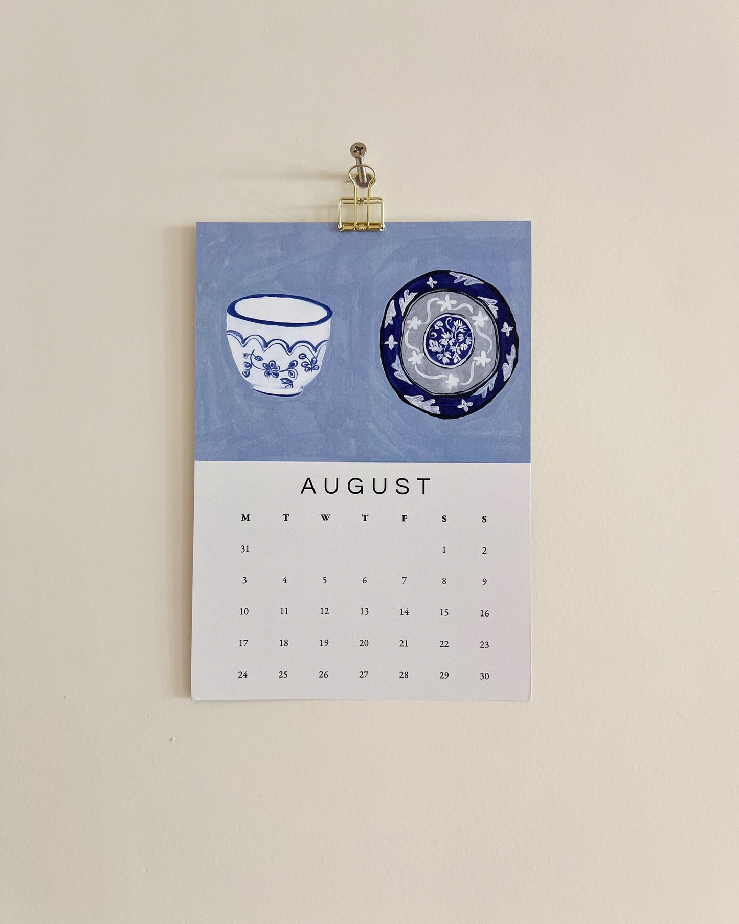 2026 Wall/Desk Calendar with August sketchbook original art/illustration of two decorative plates and bowls in blue and white.