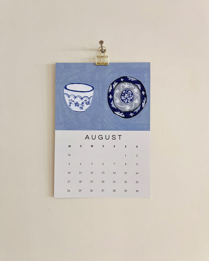 2026 Wall/Desk Calendar with August sketchbook original art/illustration of two decorative plates and bowls in blue and white.