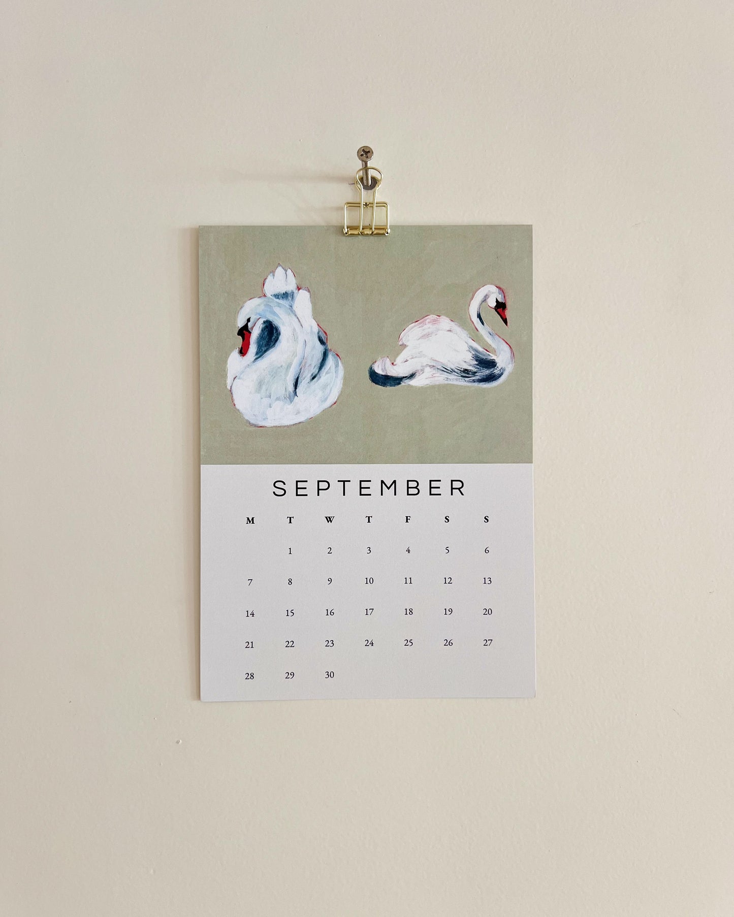 2026 Wall/Desk Calendar with September sketchbook original art/illustration of two swans with a green background.