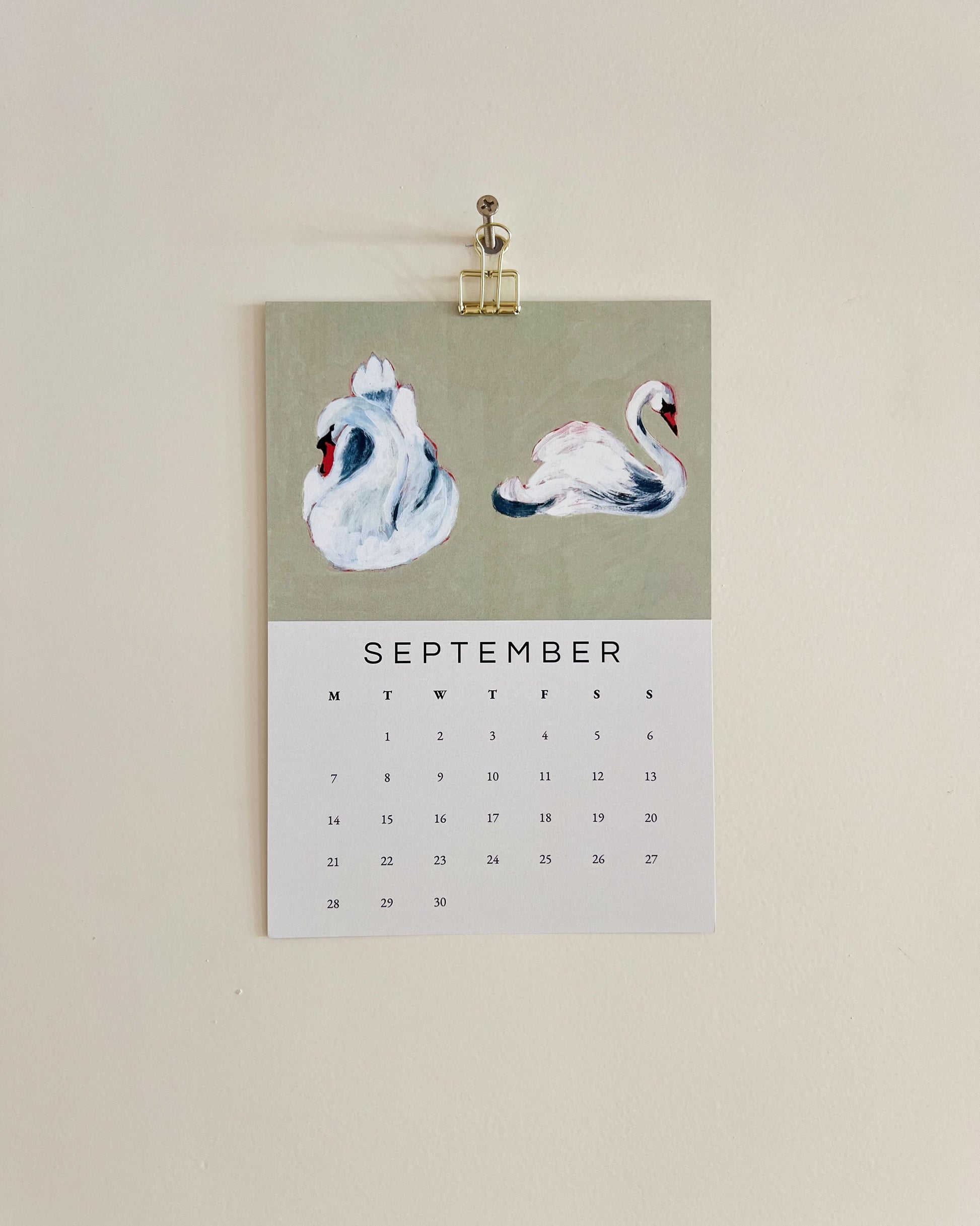 2026 Wall/Desk Calendar with September sketchbook original art/illustration of two swans with a green background.