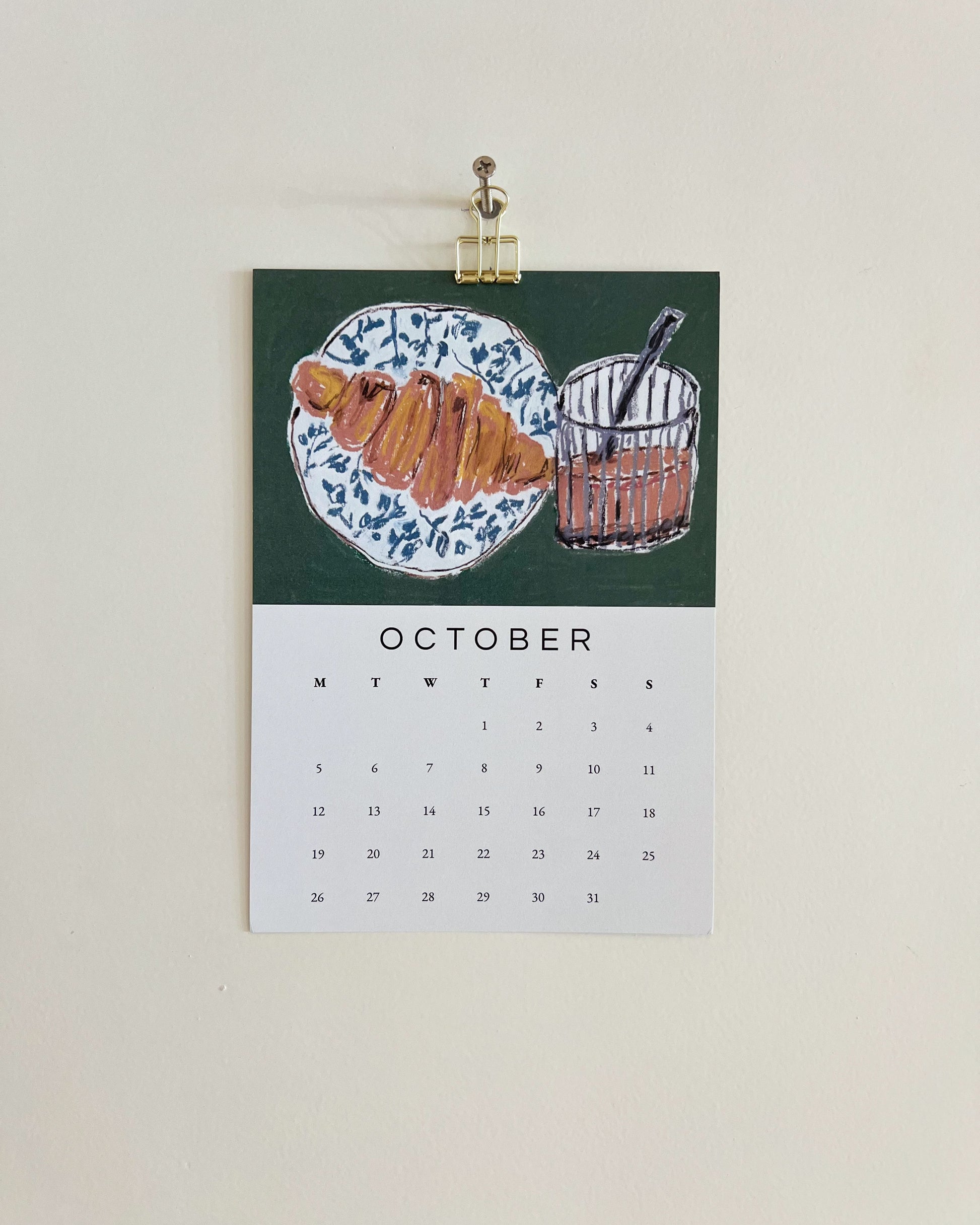 2026 Wall/Desk Calendar with October sketchbook original art/illustration of a croissant and vietnamese coffee in oil pastels.