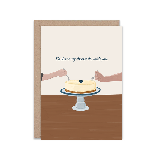 Greeting card with an illustration of two hands reaching towards a cheesecake on a wooden table.